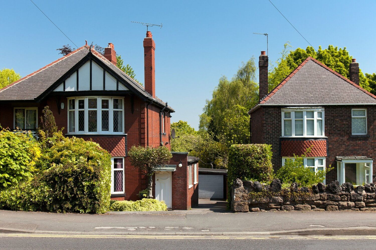 Photo of two British semi-detached houses